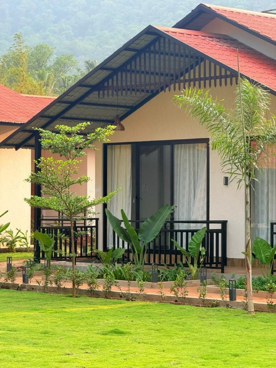 Nadi Teera red-roof cottage with private sit-out amid gardens