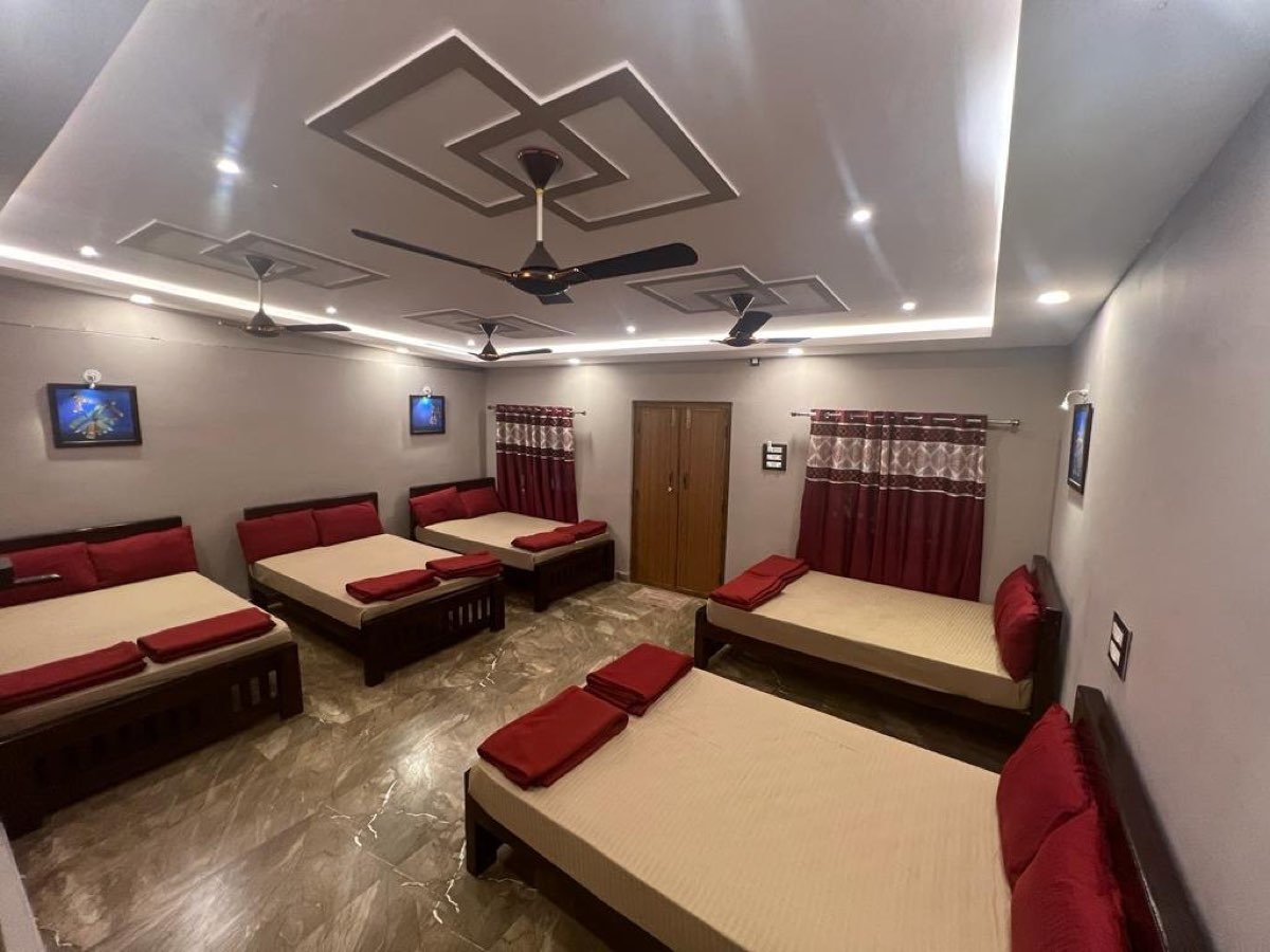 Dormitory hall with several beds at River Point