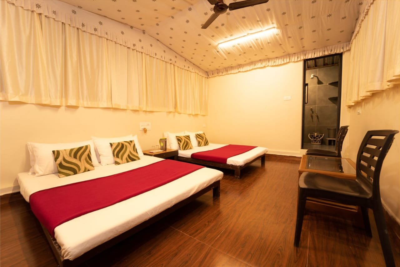 Tent-style room with two double beds
